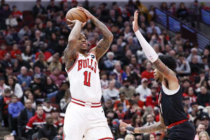 Chicago Bulls forward DeMar DeRozan (11) shoots against Portland Trail Blazers guard Anfernee Simons (1) during the first half at United Center. 